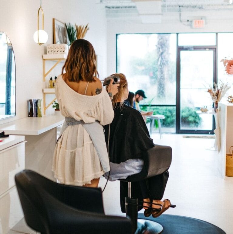 a woman getting her hair done in a salon
